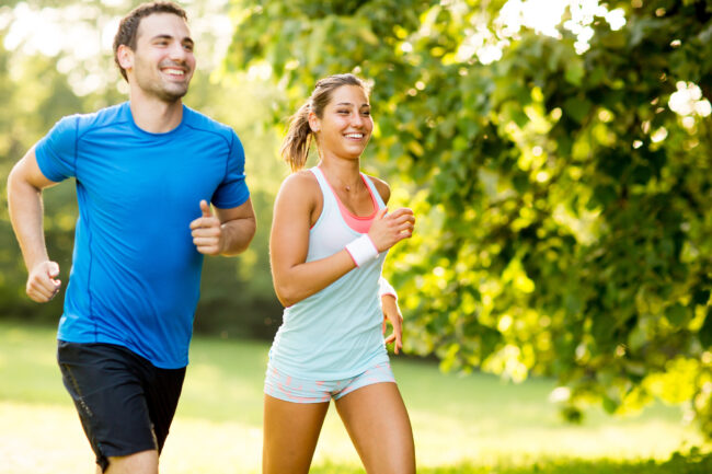 Young couple running Signs You May Need a Total Hip Replacement