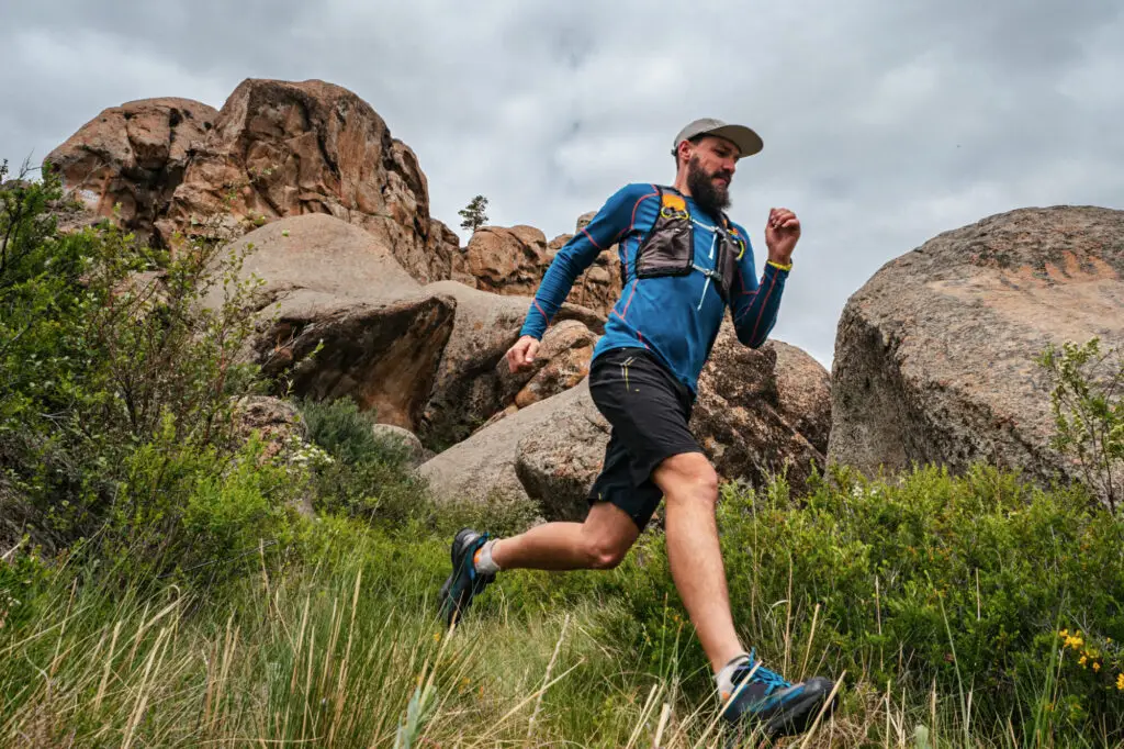 Male runner running on a mountain trail.